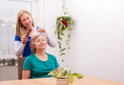 caregiver taking care of the old woman